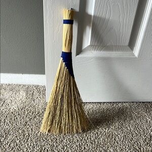 Handcrafted Straw Broom with Blue Accent wall decoration